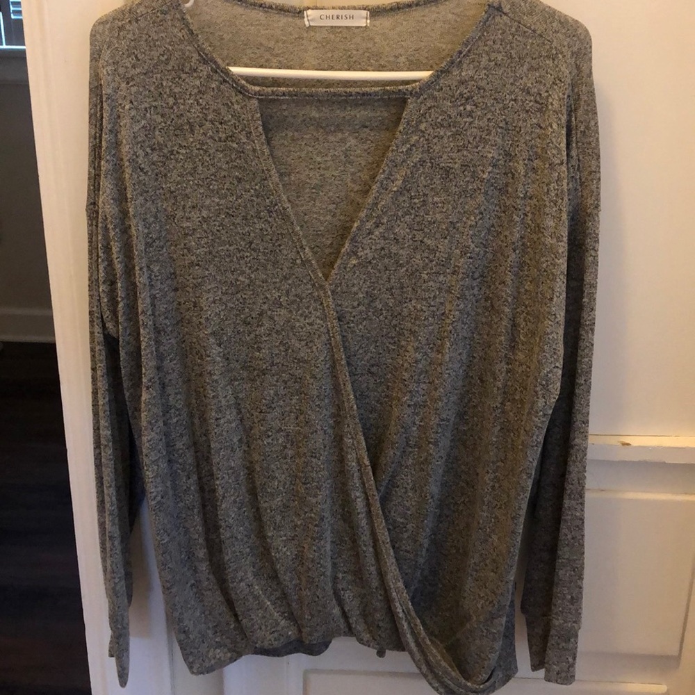 Long sleeve gray top with deep V neck.